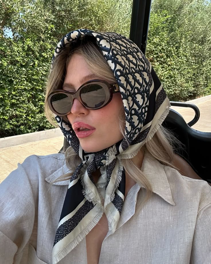 silk scarves and oversized sunglasses